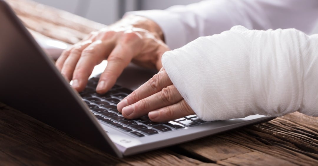 Business-Person-Hand-Injury_Using_Laptop