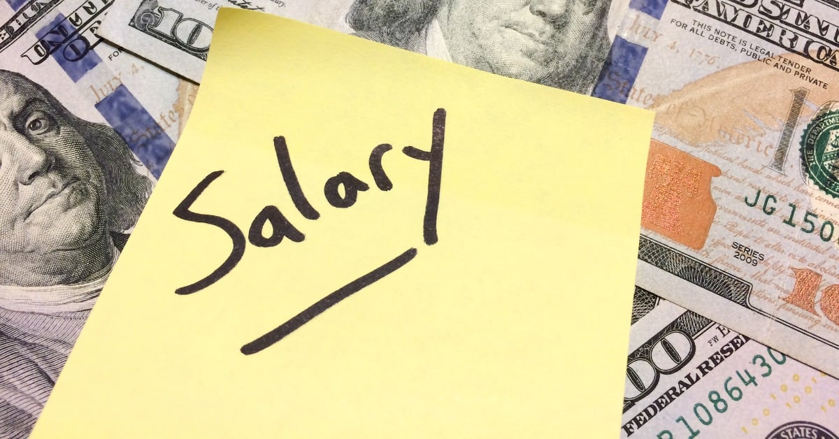 image of 100 dollar bill with yellow post-it note with Salary handwritten in black ink