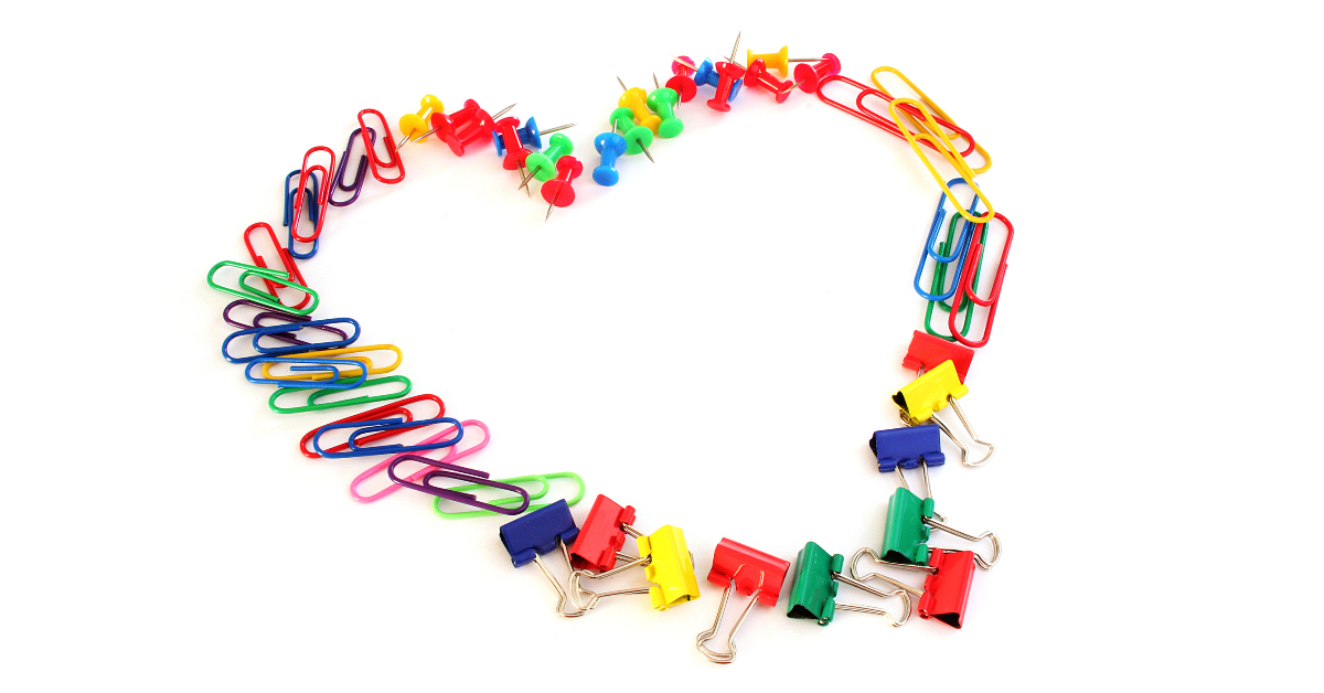 image of heart made out of colorful paper clips, push pins, and binder clips