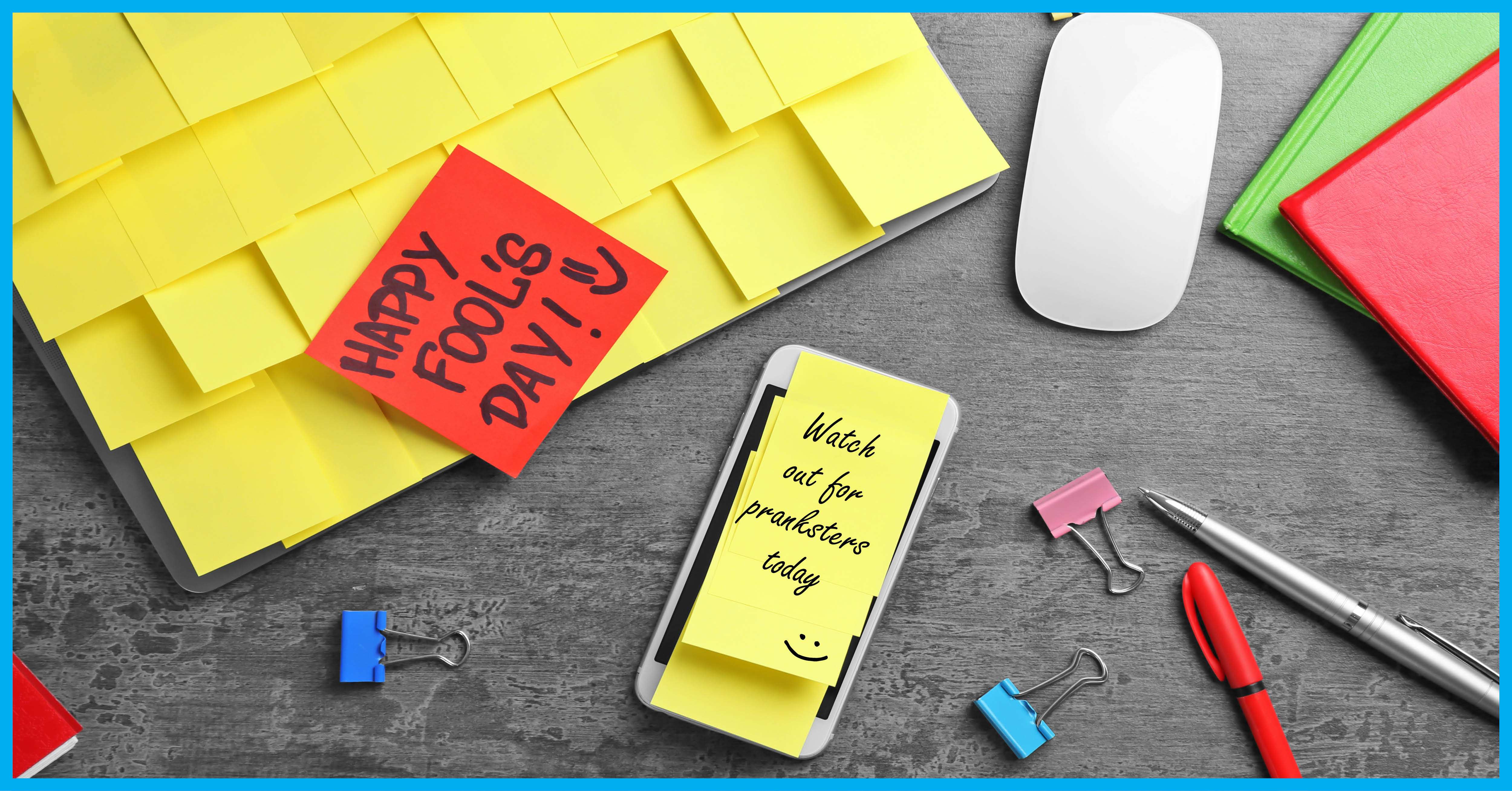 Sticky notes covering a computer with one red sticky note with Happy Fool's Day written on it