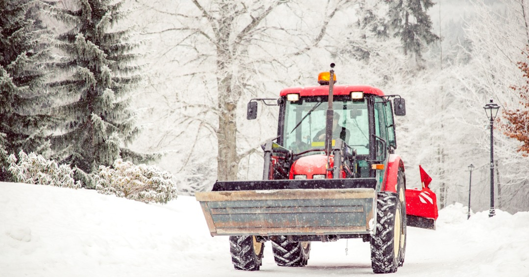 big tractor cleans road from snow in the winter. seasonal work, cold, weather, white, ice, machine, removal, vehicle, outdoor, snowplow, truck, nature, blizzard, transportation, urban, wheel, tree, city, clear, snowfall, storm, cleaning, driving, street, moving, industry, bucket, frost, landscape, blade, excavator, dump, snowy, service, wheeled, worker, path, environment, snowstorm, loader, industrial, plowing