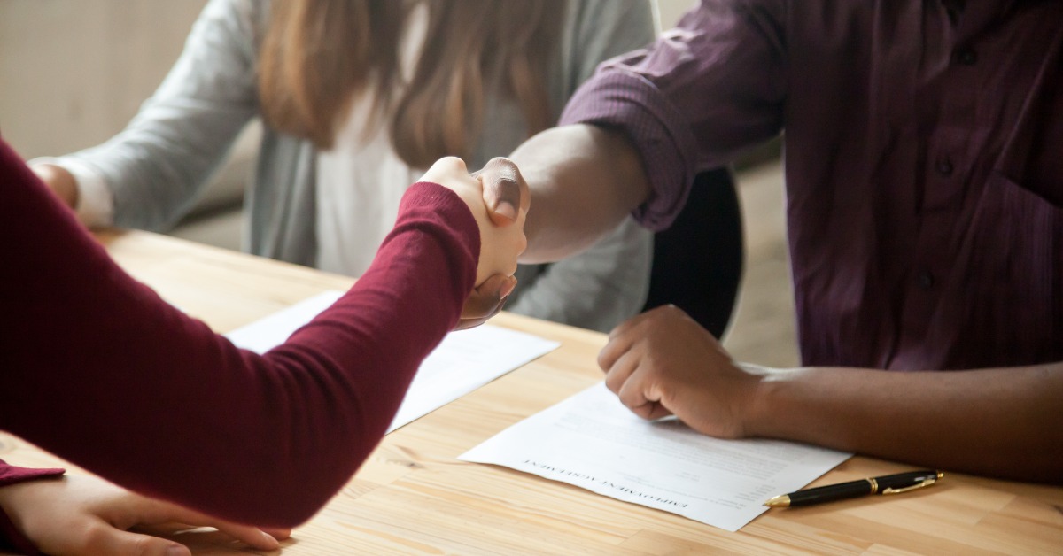 image of two people shaking hands