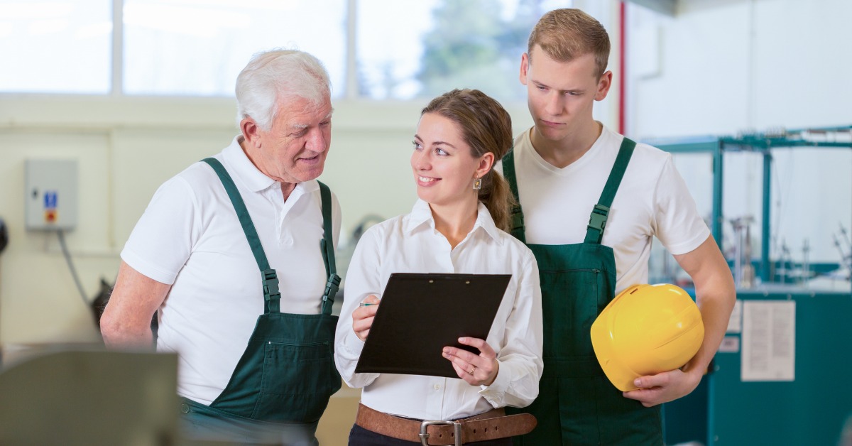 three workers reviewing a list