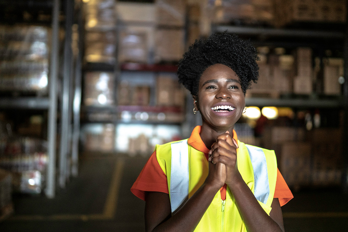 GettyImages-1183478431-Grateful young woman worker at warehouse