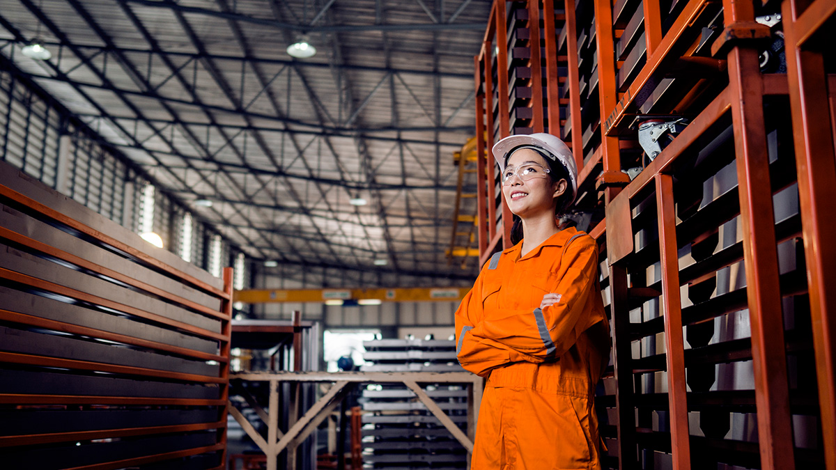 GettyImages-1264790849-Woman wearing hardhat and safety vest