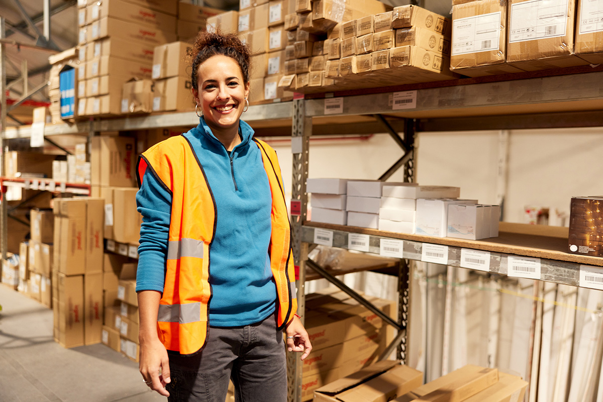 GettyImages-1367106315-Three-quarter portrait of a female blue-collar worker. She is looking at the camera.